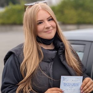 Alice with her driving test pass certificate