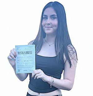 Girl holding test pass certificate